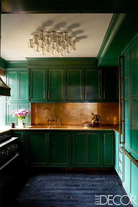 Cameron Diaz's Manhattan home, designed by Kelly Wearstler, features a show-stopping green and brass kitchen. The backsplash, counters and sink fittings are all unlacquered brass while then brass-trimmed cabinetry is lacquered in a custom color. The wood floors were treated with an ebony stain and then cerused. Manhattan Kitchen, Celebrity Kitchens, Green Kitchen Designs, Dark Green Kitchen, Серая Кухня, Famous Interior Designers, Green Kitchen Cabinets, Manhattan Apartment, Green Cabinets