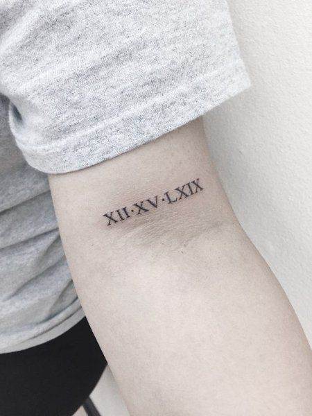 Roman Numerals Font Tattoo, Roman Numeral Font Style Tattoo Ideas, Tattoo Fonts Roman Numerals, Roman Numeral Bicep Tattoo, Roman Numbers Tattoo Arm, Roman Numerals On Forearm, Roman Numerals Arm Tattoo, Bicep Roman Numeral Tattoo, Roman Numeral Tattoo On Forearm