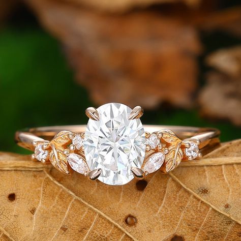 Engagement Ring Metal Type: 925 Sterling Silver, Soild 10k Gold, Solid 14k Gold, Solid 18k Gold Center Stone: Moissanite Center Carat Weight: Oval Cut 1.50CT (6*8mm) Side Stones: Moissanites - 0.16ctw (DEF, VVS1)  Band Width: 1.3 5mm SKU: ESYFXR0548 *Shipped with beautiful ring box; *Directly price from Manufacturer, 1/3 the price from Jewelry Store; - Ethically Sourced Oval Cut Engagement Ring Gold, Branch Engagement Ring, Nature Inspired Engagement Ring, Cute Engagement Rings, Oval Cut Engagement Ring, Nature Ring, Ring Ideas, Ring Metal, Beautiful Ring