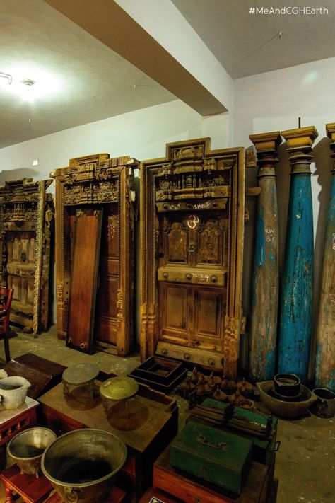 Old truly is gold at this little antique market lane in Karaikudi. Here, you will find beautiful doors, rocking chairs and swings on display for you to buy and treasure forever. Be sure to drop in and go back in time on your next stay at Visalam. #MeAndCGHEarth #Visalam #Karaikudi #Antiquemarket #Antiques #Chettinad #ChettinadArchitecture #Heritage #ChettinadHome #Culture #TravelTamilnadu #SouthIndia #OffbeatTravel #CGHExperiences Karaikudi Houses, Chettinad House, Go Back In Time, Art Deco Architecture, Rocking Chairs, Antique Market, Beautiful Doors, Old World Charm, Drop In