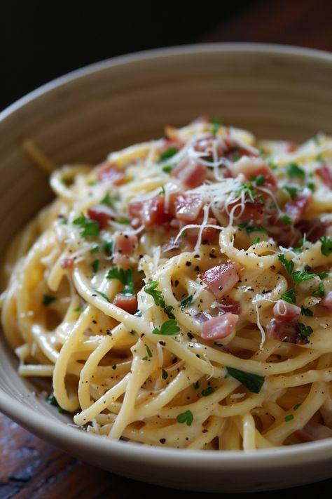 Indulge in the ultimate comfort food with this classic Spaghetti Carbonara recipe. With just a few simple ingredients like crispy pancetta, creamy eggs, and savory Pecorino Romano cheese, you can create a delicious pasta dish that will transport your taste buds to Italy. The rich and velvety sauce coats each strand of spaghetti perfectly, making every bite a flavorful experience. Egg Pasta Recipe, Pancetta Recipes, Crispy Pancetta, Spaghetti Carbonara Recipe, Creamy Spaghetti, Delicious Spaghetti, Pasta Alla Carbonara, Creamy Eggs, Seafood Pasta Recipes