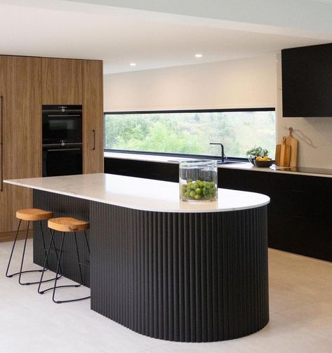 Imperial. Kitchens by Design on Instagram: "A curved island bench has been all the craze lately! We are thrilled to see this kitchen come to life 🖤 Doors: @bonlexaustralia ~ Black Satin Flat Profile Feature Island: @porta_timber ~ Black Curved Contour Benchtop: @stoneambassadoraus ~ Statuario Signature #imperialkitchens #kitchenrenovation #kitchens #kitchendesign #interiordesign #homedecor #interiors #kitchensofinstagram #home #kitchenideas #kitcheninspiration #kitchenisland #kitchengoals #re Timber Look Kitchen, Black Island Bench, Feature Kitchen Island, Feature Island Kitchen, Black Fluted Kitchen Island, Black Fluted Island, Fluted Island Bench, Modern Timber Kitchen, Curved Kitchen Benchtop