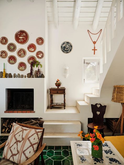 Inside designer Carolina Irving's Portuguese house | House & Garden Corner Wood Stove, Portuguese House, Elegant Fireplace, Carolina Irving, House With Land, Queen Anne House, Greek Decor, Built In Banquette, Rustic Retreat