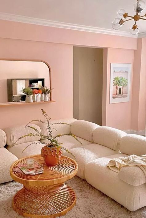 Pastel pink makes a beautiful canvas that gives off soft, gentle, and relaxing vibes. If those are all things you want to welcome into your living space, pale pink is a great choice. When styling your pink living room, look to a sunset for inspiration and choose a cloud-like bouclé materials like this space from domandecors. #royalcore #pinklivingroomideas #pastellivingrooms #itgirllivingroom #pinkcoredecor #romanticlivingroomdecor #thespruce #romanticdecor Pink Living Room Paint, Lounge Colours, Blush Pink Living Room, Sunset Room, Burgundy Background Aesthetic, Functional Living Room, Pantone 2024, Living Room Pink, Room Ideas Apartment