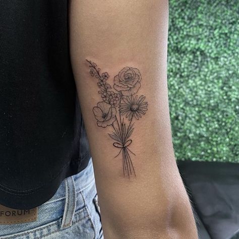 Floral bouquet tattoo | Artist: Tamia Overes Bouquet Of 4 Flowers Tattoo, Tattoo Flowers Bouquet, Bouquet Of Different Flowers Tattoo, Family Boquet Tattoos, Small Boquetes Of Flowers Tatoos, Line Work Flower Bouquet Tattoo, Memorial Bouquet Tattoo, Flower Bouquet Tattoo Upper Arm, Flower Bouquet Tattoo On Arm