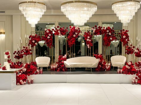 The stunning red floral stage we designed for our couple, serving as the statement backdrop for their special day. The lush red flowers and intricate arrangements created a bold and beautiful centerpiece for their celebration 🌹 Styling, decor, flowers and set up by @museweddingsandevents Candles by @rosewood.candles Venue @thehighlinevenue Sangeet Decor, Red Wedding Decorations, Reception Backdrop, Red Backdrop, Wedding Backdrop Decorations, Party Deco, Decor Flowers, Wedding Stage Decorations, Flower Centerpieces Wedding