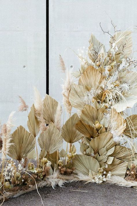 Beautiful Modern French dried flower installation with pods, palms, pampas grass and thistle.  #driedflowers #driedfloral #shabbychicfloral #weddingdecor Christmas Banquet, Photowall Ideas, Booth Designs, Tropical Wedding Inspiration, Palm Wedding, Dried Flowers Wedding, Safari Chic, Festival Bride, Photo Sets