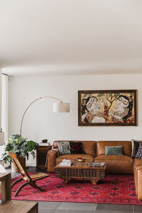 Living room with arch lamp leather couch persian rug Indian inspired home in the Glebe Ottawa Ontario Studio-Kahaani-Ottawa-interior-design-inspiration-ideas-brand-photos-by-Sonia-V-Photography Red Rug Leather Couch, Leather Couch Persian Rug, Sofa With Chairs Layout, Apartment With Dark Floors, Styled Leather Couch, Adobe Style Living Room, Arching Lamp Living Room, Living Room Inspiration Persian Rug, Indian Inspired Modern Home