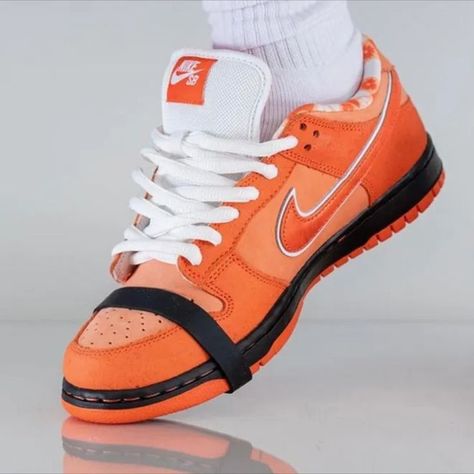 Since sneaker retailer Concepts first joined forces with Nike in 2008, the Lobster Dunk series has made waves in the sneaker world. With pairs flying off the shelves and resale prices going through the roof, you can bet the Concept SB Dunk Low Orange Lobster will be coveted by all. How did it all start? In 2008, when tasked to collaborate with Nike, Boston-based sneaker retailer Concepts decided to pay homage to the lobster. Thus, the very first Red Lobster Dunk Low was born. Orange Lobster Dunks, Dunk Orange, Dunk Low Orange, Shoes World, Nike Sb Dunk Low, Red Lobster, Sb Dunk Low, Nike Sb Dunks Low, Nike Sb Dunk