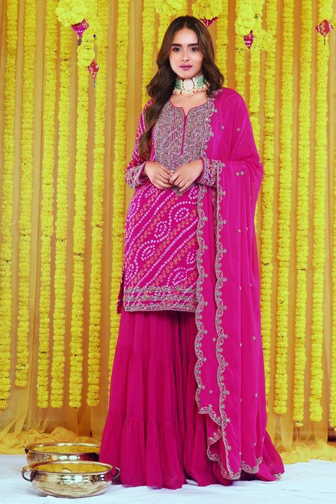 Buy Pink Georgette Hand Embroidered Bandhani Round Kurta Sharara Set For Women by Bharat Adiani Online at Aza Fashions. Pink Bandhani Dress, Bandhani Sharara Suit, Bandhani Suits Design, Pink Haldi Outfit, Bandhani Sharara, Outfits From Saree, Sharara Suit Designs Latest, Bandhani Dress Pattern, Chunri Dress