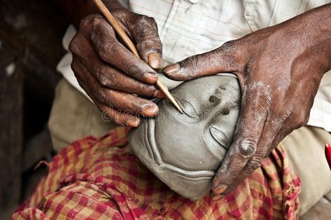 Making clay idol. An artisan creates the head of a goddess for Durga puja festiv #Sponsored , #sponsored, #paid, #idol, #Making, #creates, #artisan Making Clay, Durga Puja, A Goddess, Durga Goddess, The Head, Garden Sculpture, Photo Image, Stock Images, Logo Design