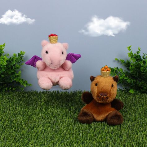 Meet Sid Capybara, the escape room maestro🤎 Aria Pink Dragon and Sid are in an epic showdown to see who can balance fruit longer! 🍎 Who's your pick for the ultimate fruit-balance champ?🍊 Find out more about Sid in our IG Story Interview series! #palmpalsparty #palmpals #plushies #plushlife #plushieslife ⁠#stuffedanimal #kawaiiplush #cuteplush #stuffedanimalsofinstagram#capybara #capybaralove Potion Seller, Palm Pals, Puff The Magic Dragon, Magic Dragon, Angel Demon, Stuff Animals, Pink Dragon, Kawaii Plush, Escape Room