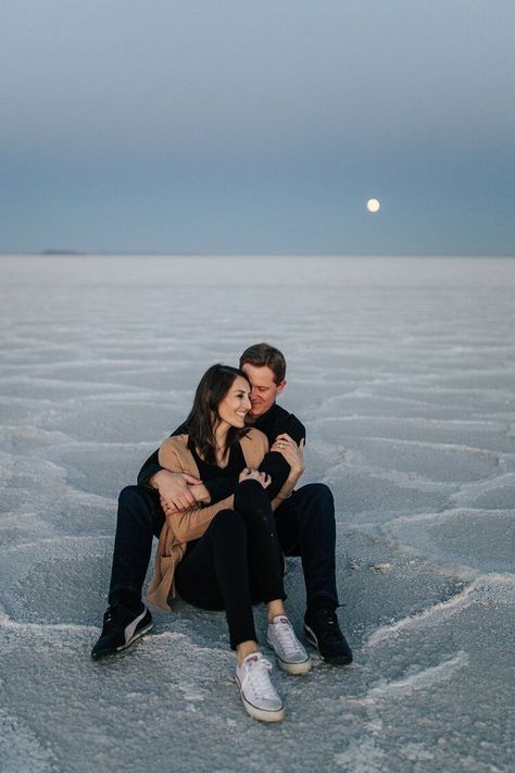 A beautiful couple sit on the sand at Utah’s Salt Flats in a beautiful engagement styled photo shoot session by professional photographer Emily Jenkins Photography. Sitting couple pose inspiration ideas and goals engagement session location inspiration ideas and goals Bonneville Salt Flats engagement #engagements #photographer #utahphotographer Bonneville Salt Flats Engagement Photos, Salt Flat Engagement Photos, Salt Flats Utah Photoshoot Couple, Salt Flats Engagement Photos, Salt Flats Utah Photoshoot, Salt Flats Photoshoot, Utah Engagement Photos, Salt Flats Utah, Bonneville Salt Flats