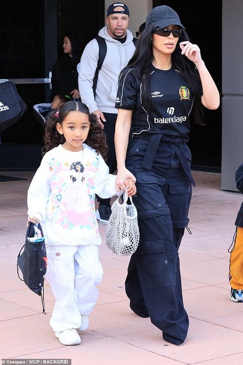 Kim Kardashian rocks Balenciaga jersey as she brings Chicago to support brother Saint at basketball game in LA... after attending ex Kanye West's listening party Check more at https://maholicious.com/kim-kardashian-rocks-balenciaga-jersey-as-she-brings-chicago-to-support-brother-saint-at-basketball-game-in-la-after-attending-ex-kanye-wests-listening-party/ Chicago West Outfits, Balenciaga Jersey, Balenciaga Outfits, Balenciaga Cap, Chicago West, Style Balenciaga, Monroe Dress, Kim Kardashian Kanye West, Listening Party