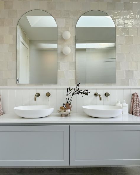 Double Vanity Basin with two mirrors white tile walls