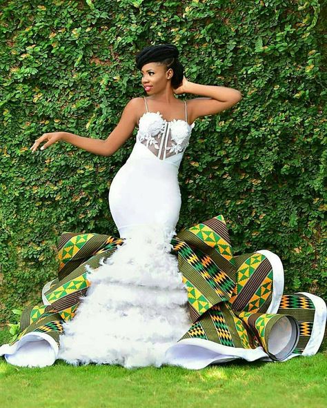 A white wedding dress with some Kente twist! See the back above  For full features from her wedding visit… African Print Wedding Dress, African Inspired Wedding, African Traditional Wedding Dress, African Wedding Attire, African Traditional Wedding, Afrikaanse Mode, Gaun Fashion, African Wedding Dress, African Traditional Dresses