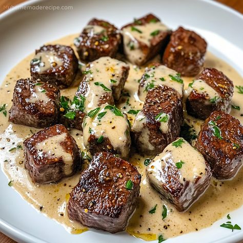 Garlic Butter Steak Bites paired with a luscious Parmesan cream sauce make a savory and satisfying dinner. Ready in just 25 minutes! Steak Bites Cream Sauce, Steak And Cream Sauce, Garlic Butter Steak Dinner, Steak With Garlic Butter Sauce, Steak In Garlic Butter Sauce, Steak Bites With Dipping Sauce, Dinner Ideas Steak Bites, Garlic Bread Steak Bites Appetizer, The Best Steak Recipes