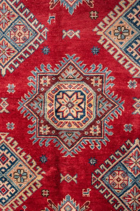 Size491x362cm All Lilla Rugs are one of a kindLittle bit of story behind this oneAn Afghan Kazak rug is a hand-knotted rug inspired by traditional Caucasian designsknown for its bold geometric patterns and vivid colour paletteThese rugs often feature tribal motifs such as medallionsdiamondsand crosseswith striking redsbluesgoldsand creamsWoven using high-quality woolAfghan Kazak rugs are prized for their durabilityand vibrantenergetic lookTheir rich designs and br Iranian Carpet Pattern, Iranian Photography, Afghan Art, Lilla Rugs, Iran Art, Afghanistan Flag, Baby Animal Nursery Art, Iranian Rugs, Iranian Carpet