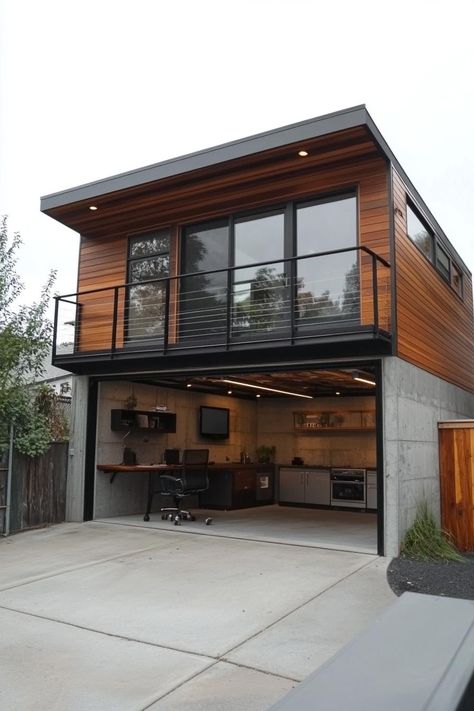 Modern garage unit with upstairs home office. Check out these stunning modern houses with a garage that blend functionality and style seamlessly. Loft Garage House, Detached Garage With Rooftop Deck, Living In Garage While Building House, Modern Garage Addition, Nantucket Garage, House Over Garage, Office In Garage, Modern Car Garage, Garage Loft Ideas