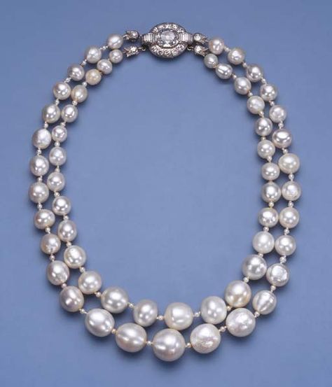 AN IMPORTANT ANTIQUE TWO STRAND PEARL NECKLACE Comprising twenty-eight and twenty-nine graduated pearls, total weight, excluding clasp, approximately 1,852 grains (463 carats), measuring 6.8 to 15.5 mm. with seed pearl spacers and diamond foliate terminals to the vari-cut diamond cluster clasp, pearls 18th century or earlier, clasp later, 40.5 cm. long Single Strand Pearl Necklace, Earring Displays, Natural Pearl Necklace, Pearl Jewels, 2 Rings, Heart Choker, Pearl Choker Necklace, Royal Jewels, Set Necklace