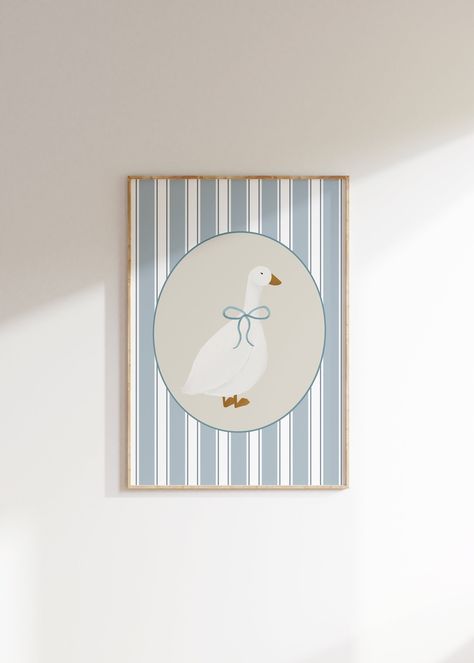 This Listing is for a Cute Goose with a light blue bow Wall Art Printable, with a light blue striped background. Perfect for a gender neutral kid's room, playroom, or nursery! I have a lot of similar and complimentary pieces, so please check out my shop! PLEASE NOTE, THIS IS A DIGITAL DOWNLOAD ONLY. No physical product will be shipped. All files are available immediately after purchase for download. You will receive a PDF with a download link. Just download, print, and frame! Once your payment i Light Blue Walls Nursery, Blue Nursery Art, Vintage Goose Nursery, Blue Vintage Nursery, Goose Themed Nursery, Blue Nursery Ideas, Stripes Nursery, Goose Poster, Aesthetic Nursery