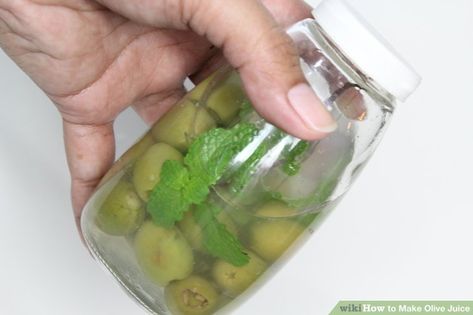 How to Make Olive Juice: 15 Steps (with Pictures) - wikiHow Olive Juice Recipe, Fresh Olives, Olive Jar, Olive Juice, Drinking Party, Peppermint Leaves, Cucumber Tomato, Glass Mason Jars, Green Olives