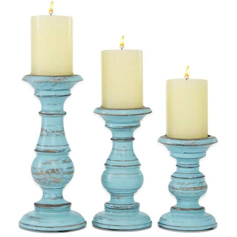 Get the Mango Wood Traditional Candle Holder Set at Michaels. com. These hand-carved mango wood votive candle holders are the finishing touches you are looking for in your natural and traditional interiors. These hand-carved mango wood votive candle holders are the finishing touches you are looking for in your natural and traditional interiors. The voluminous silhouettes and carved ridges were crafted from mango tree wood. Each piece in this set of three has a metal plate with a spike to secure Coastal Candle Holders, Wooden Pillar Candle Holders, Coastal Candle, Wood Pillar Candle Holders, Wooden Pillars, Seashell Candles, Wood Candle Holder, Pillar Candle Holder, Wood Candle