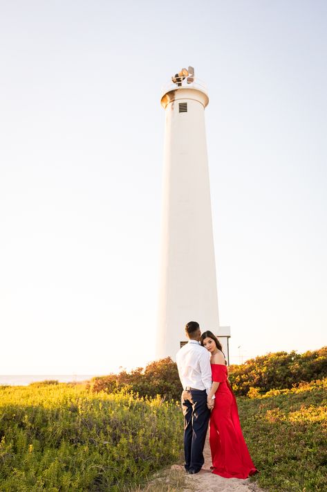 Lighthouse Couple Photos, Lighthouse Photoshoot Ideas, Lighthouse Engagement Photos, Red Dress Engagement Pictures, Lighthouse Photoshoot, Lake Wedding Pictures, Engagement Board, Military Engagement Photos, Funny Engagement Photos