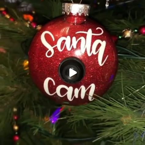 CHRISTMAS COUNTDOWN on Instagram: "Brilliant idea by• @craftingbylizzy Santa Cam! 🎅🏽👀🎥, Definitely [SAVE IT FOR LATER]

What you need:
-cricut/tools/transfer tape
-white vinyl (cutout is on cricut access)
-clear ornament
-fine red glitter
-glue for the inside (I used polyurethane but other glues could work)
-fake camera lens (cricut access also has a cutout of a lens if the lens isn’t available in your craft store)
.
.
.
#cricut #cricutmade #cricutmaker #cricutcrafts #diycrafts #quarantine #quarantinecrafts #satisfyingvideos #satisfying #cricutvinyl #diy #diycrafts #asmrsounds #homemade #madewithmichaels #quarantinecrafts #papercrafts #vinyl #cricutvinyl #vinylweeding #christmas #christmascrafts #quarantinechristmas #homemadegifts #cricutcreations #cricutprojects #diychristmasornaments Cricut Tools, Cricut Access, Santa Cam, Clear Ornaments, Glitter Glue, Cricut Creations, Craft Store, Transfer Tape, Cricut Vinyl