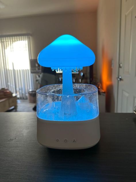 This mushroom cloud-shaped lamp functions as a humidifier and includes essential oils. I enjoy falling asleep with the rain setting on Mouth Wash Dispenser, Mouthwash Dispenser, Mouth Wash, Mushroom Cloud, Cloud Lamp, Cozy Room Decor, Lotion Dispenser, Mouthwash, Aesthetic Room Decor