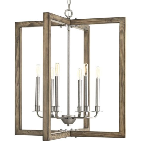 The solid wood frame of this lantern has a weathered, driftwood style finish that makes this fixture perfect for coastal and nautical styled rooms. The Galvanized finish of the body and hardware is a beautiful neutral accent to the wood frame that allows this fixture to blend with a range of modern decor. Grey Entryway, Glass Globe Chandelier, Wide Chandelier, Coastal Chandelier, Rectangle Chandelier, Farmhouse Chandelier, Candle Style Chandelier, Geometric Chandelier, Foyer Pendant