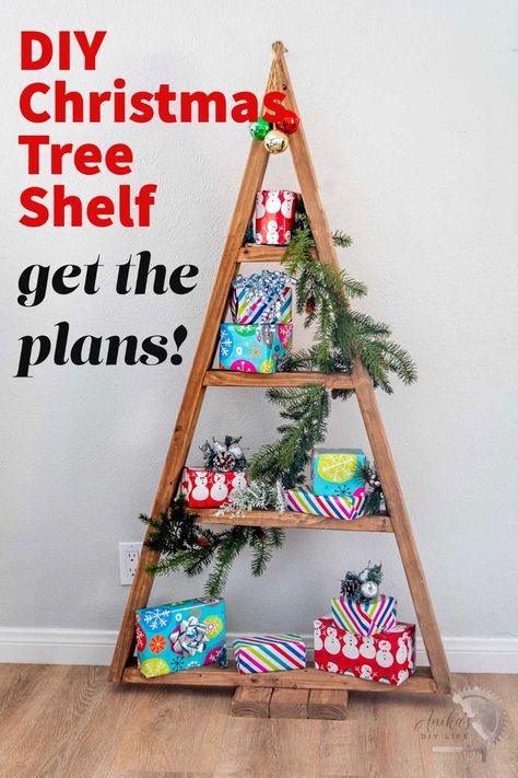 DIY wooden Christmas tree shelf with presents and faux greenery. with text overlay Alternative Christmas Tree Diy, Easy Diy Christmas Tree, Christmas Tree Shelf, Knick Nacks, Diy Trees, Christmas Shop Displays, Christmas Shelf, Tree Shelf, Wooden Christmas Tree Decorations