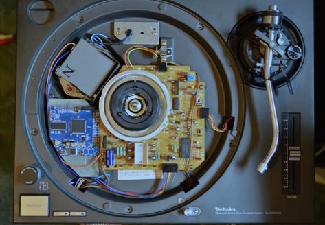 Russian turntable enthusiast shows off his unique mod.An intrepid YouTube user has hacked a pair of Technics SL-1200 turntables to play a digital library of tracks. The mod works with the aid of control vinyl but doesn't require an external DVS system... Technics Hifi, Technics 1200, Technics Sl 1200, Technics Turntables, Crate Digging, Phono Cartridge, Top Fuel Dragster, Old Technology, Digital Library