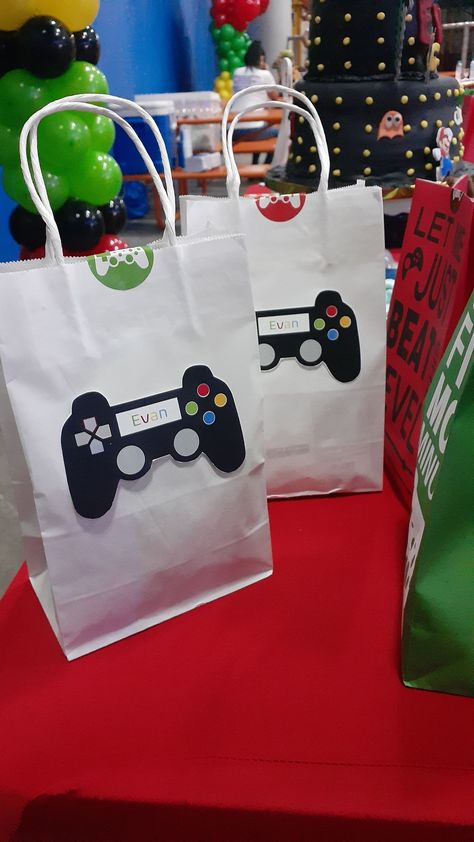 I needed extra favor bags since a few friends decided to go at last minute, so i searched for printable images, edited and printed them. Playstation Birthday, Astro Bot, Video Game Cakes, Lolly Bags, Jordan Logo Wallpaper, Video Games Birthday Party, Video Games Birthday, Birthday Bag, Party Favors For Kids Birthday