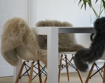 Sheepskin rugs for dining chairs genuine superior sheepskin for a nordic look. Create hygge! Dining Room Chair Slipcovers, White Dining Room Chairs, Thrown Chair, Dining Room Chair Covers, Sheepskin Rugs, White Dining Room, Faux Leather Dining Chairs, Dining Chair Covers, Sheep Skin