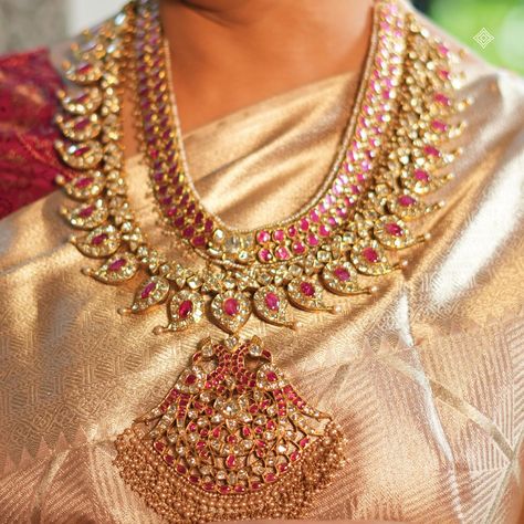 Illuminate your festivities with the radiant allure of our heritage Mango Mala. Adorned with vibrant rubies and valanda stones with a stunning peacock motif pendant lined with pearl drops, this versatile two-layered necklace adds timeless elegance to any celebration. Detachable layers allow you to style it your way, making it a cherished piece for every occasion. WhatsApp 9964641869 for enquiries. 📍Visit the Blue CKC&Co. Flagship store, near Safina Plaza. Look for the DIAMOND logo! #Herit... Mango Mala, Mango Necklace, Peacock Motif, Neck Pieces Jewelry, Indian Bridal Jewelry Sets, Bridal Jewellery Design, Diamond Logo, Jewelry Set Design, Antique Bridal Jewelry