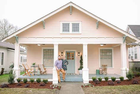 When Erin Napier shared her vision for a blush pink bungalow with seafoam-green trim, we'll admit we were a little (OK, more like majorly) skeptical, but seeing the finished result of this polished craftsman heritage home, after an extensive $109,000 renovation, we'll never question Erin again! See how she and husband Ben converted this forgotten bungalow into a teacher's dream home. Watch Home Town Sundays at 9PM e/p and stream Live and On Demand on the new Global TV App, and on STACKTV wit White House Pink Front Door, Pink Bungalow Exterior, Blush Exterior House, Peach Pink House Exterior, Pastel Home Exterior, Soft Pink House Exterior, Pink House Green Shutters, Peach House Exterior Color Schemes, Pale Pink House Exterior