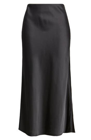 Complete your look with the understated sophistication of this smooth satin midi skirt. 32" center front length ( size Medium) Unlined 54% polyester, 46% rayon Machine wash, line dry Imported Notion Wishlist, Satin Black Skirt, Corporate Clothes, Minimalist Winter Wardrobe, Midi Satin Skirt, Black Satin Midi Skirt, Minimalist Skirt, Winter Essentials Clothes, Black Midi Pencil Skirt