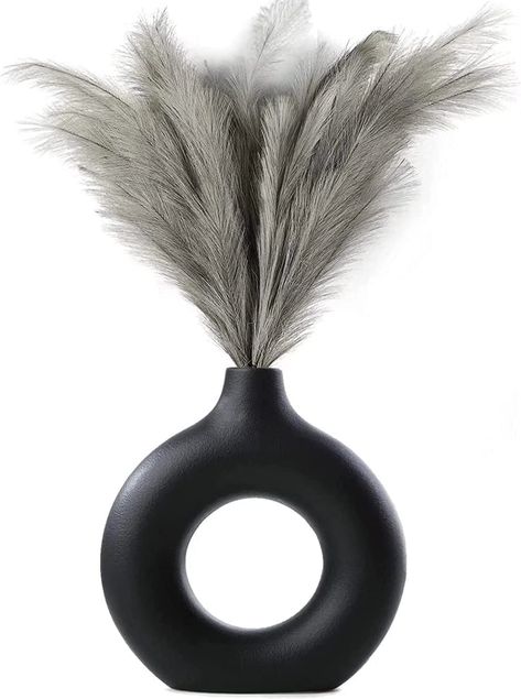 PRICES MAY VARY. 🌷【UNIQUE MODERN DESIGN 】– If you are tired of those dull and boring designs, then you will definitely be attracted by these beautiful hollow design black ceramic vases for home décor. The donut design makes the flower vases unique and stylish; you can see through the hollow out while enjoying beautiful flowers in the vase, which adds more romance and fashion to your house. 🌷【 EQUISITE & FLAWLESS DETAILS】 – Each Pampas Grass decorative vase is professionally designed and handcr Pampas Flower, Wedding Dinner Table, Style For Wedding, Donut Vase, Black Ceramic Vase, Nordic Boho, Party Living Room, Nordic Chic, Floating Shelf Decor