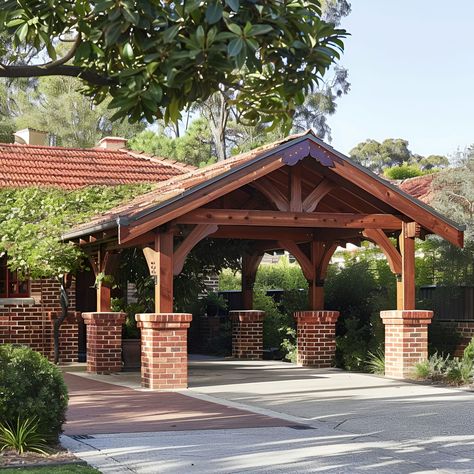 Explore this stunning carport in Western Australia, featuring red brick pillars and large wooden beams. Its traditional architecture includes a clay tile roof and lush greenery, providing an elegant, shaded parking area. Perfectly integrates with its surroundings, it offers a warm, inviting vibe, ideal for both residential and community settings. Red Brick Pillars, Traditional Carport, Brick Carport, Timber Carport Post And Beam, Oak Frame Carport, Clay Tile Roof, House Pillars, Mass Timber Structure, Brick Pillars