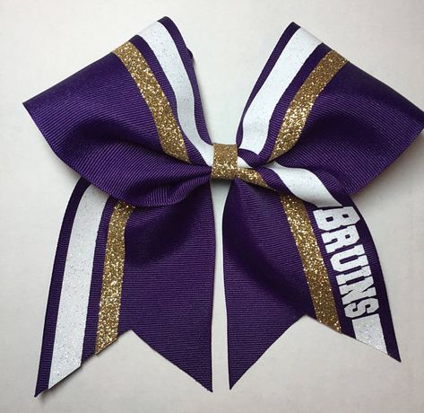 Purple gold white cheer bow High School Cheer Bows, Purple And Gold Pom Poms Cheer, Cheerleading Jumps, Cheer Bows Diy, Cute Cheer Bows, Competition Bows, Purple And Gold Cheer Bows, Sparkly Cheer Bows, Custom Cheer Bows