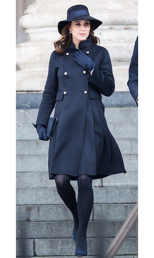 The Duchess of Cambridge opted for a demure ensemble for the Grenfell Tower national memorial service on December 14. Kate kept her baby bump under wraps wearing a double breasted double-faced wool coat by Carolina Herrera. The Duke’s wife accessorized the navy coat with matching accessories including a wide-brimmed hat, gloves, tights and her Jimmy Choo Georgia shoes.   Photo: Neil Mockford/GC Images Kate Middleton Maternity Style, Moda Kate Middleton, Kate Middleton Stil, Grenfell Tower, Expensive Outfits, Düşes Kate, Herzogin Von Cambridge, Princesse Kate Middleton, Navy Wool Coat