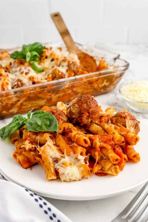 Dump and Bake Meatball Pasta Casserole is an easy dinner recipe with ziti noodles, chicken stock, pasta sauce, Italian seasoning and turkey meatballs all cooked together in one dish and then topped with mozzarella cheese. Pasta With Turkey Meatballs, Pasta And Meatball Bake, Baked Ziti With Frozen Meatballs, Baked Ziti And Meatballs, Meatball And Pasta Recipes, Recipes With Ziti Noodles, Turkey Meatball Pasta, Meatball Pasta Casserole, Ziti Noodles