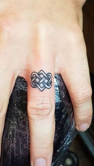 <<Check out more Celtic tattoos  #tattoomenow #tattooideas #tattoodesigns #celtic #celticknots #knots #love Celtic Love Knot Ring Tattoo, Forever Knot Tattoo, Celtic Knot Wrist Tattoo, Irish Love Knot Tattoo, Celtic Lovers Knot Tattoo, Celtic Key Tattoo, Celtic Eternity Knot Tattoo, Celtic Love Tattoo, Irish Finger Tattoo