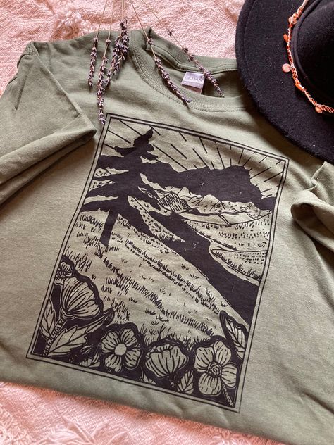 This Shirt is on preorder. and will take some time to ship! about 4 days to ship.  This T-shirt is perfect for Hikers, adventures, nature lovers. and anyone who just loves the great outdoors! It is made on procreate then reproduced through screen printing then washed.  Made with 100% combed and ring-spun cotton. The shirts are very lightweight and extremely soft. (brand of shirt Gilden)  Washing instructions: + Washing inside out is recommended + Hand wash cold or machine wash cold with like color on gentle cycle + Hang dry or tumble dry low on gentle cycle Choose your size and color from the drop down menus.  ** Please refer to the sizing chart before ordering to ensure the correct fit! **  I hope my products encourage you to get outside and explore the beautiful around you! If you have a Outdoor Shirts, Nature Shirts, Screen Printing Shirts, Outdoor Shirt, Mode Kpop, Mountain Range, Moda Casual, Graphic Shirts, Outfit Inspirationen