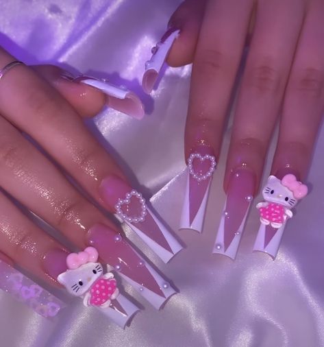 Nails With Pom Poms And Charms, Pearl Hello Kitty Nails, Big Hello Kitty Charm Nails, Purple Sanrio Nails, Kawaii Hello Kitty Nails, Hello Kitty Medium Nails, Pink And White Pearl Nails, Junk Nails Hello Kitty, Hello Kitty Valentines Day Nails