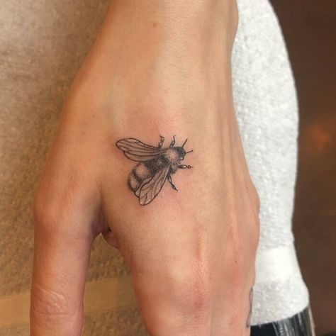 Tiny Life Size Bumble Bee Tattoo Realistic Owl Tattoo, Small Bee Tattoo, Unique Hand Tattoos, Black Line Tattoo, Bumble Bee Tattoo, Butterfly Hand Tattoo, Skull Hand Tattoo, Rose Hand Tattoo, Hand And Finger Tattoos