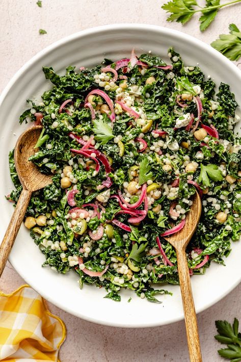 Fresh, herby kale couscous salad with feta, chickpeas, and olives that comes together in just 30 minutes for a satisfying lunch or side dish. Scoop up this beautiful salad with tortilla chips or pitas chips to get an extra delicious crunch! You'll love this veggie-packed salad as is or with your favorite grilled proteins. Ambitious Kitchen Kale Couscous Salad, Antiinflammatory Salad Recipes, Trendy Salads, Salad Ideas Aesthetic, Prepped Salads, Nutrient Dense Lunch, Kale Couscous, Dinner Salad Recipes, Veg Salads