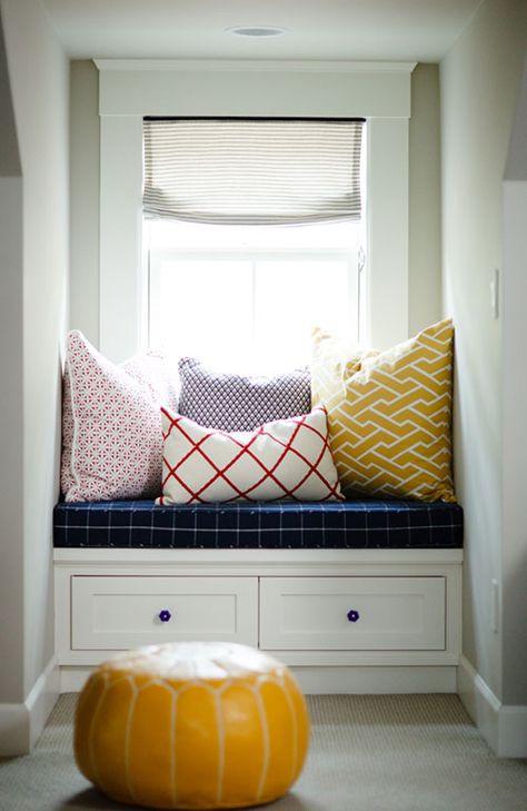 By squeezing a bench into an unused dormer you get bonus seating without taking up precious space. Here, a navy cushion and patterned pillows makes this space cozy — and stocky drawers help you stay organized. See more at Design Sponge »   - HouseBeautiful.com Window Seat Nook, Space Window, Cozy Window, Dormer Window, Cozy Window Seat, Window Nook, Country Chic Cottage, Dormer Windows, Cottage Design