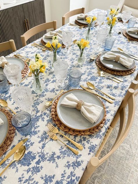 Elevate Your Spring Dining with a Stylish Tablescape! 🌼🍴 Create a stunning spring ambiance with a floral print tablecloth that's perfect for setting the scene. Accentuate with blue ceramic plates, linen napkins, rattan napkin rings, woven placemats, and gold flatware for a touch of sophistication. And for that nostalgic flair, add in vintage bud vases and goblets to complete the picture-perfect table decor. Click the link to shop! Blue Floral Tablecloth, Vintage Plates Table Setting, Rattan Placemats Table Settings, Woven Placemats Table Setting, Spring Table Scape, Napkin Table Setting, China Plates Wedding, Blue Tablescape, Floral Table Setting